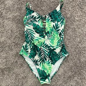 XHILARATION GREEN AND WHITE ONE PIECE SWIMSUIT WITH OPEN BACK. TIES IN THE BACK